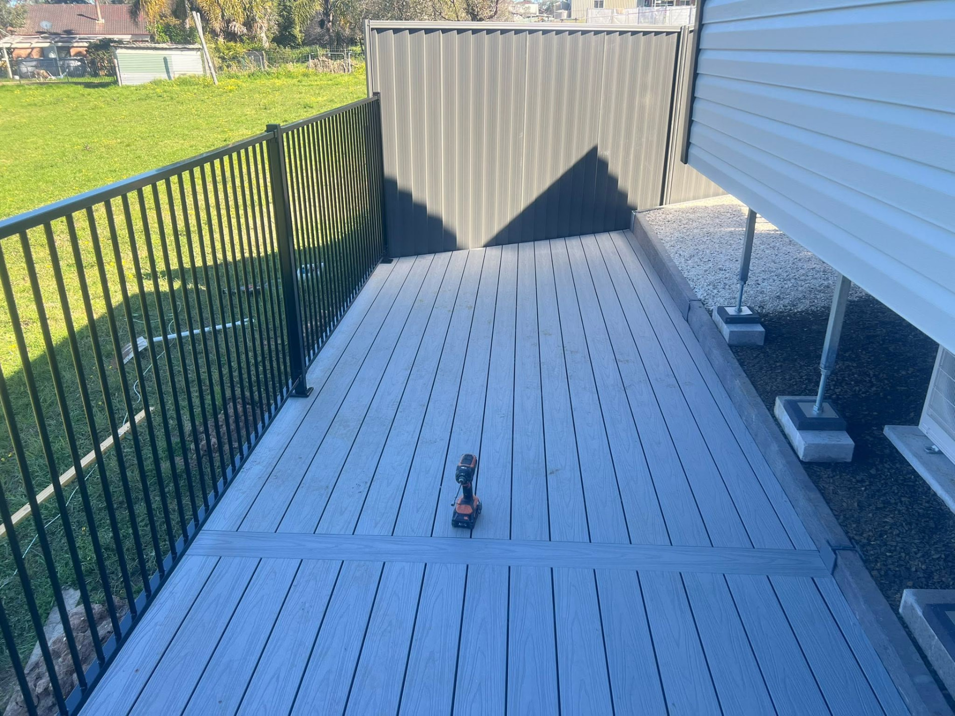 Grey composite deck with black metal balustrade