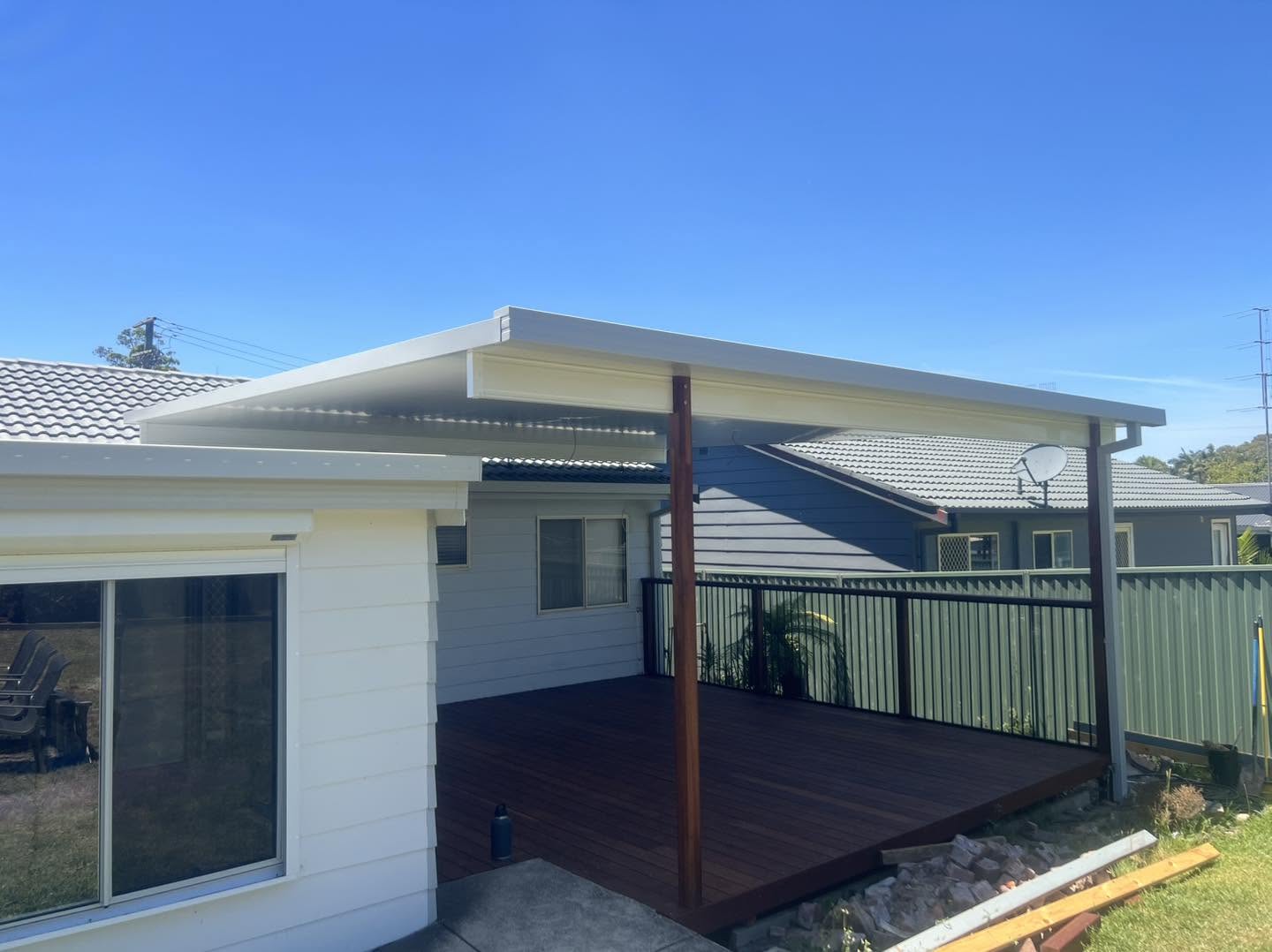Insulated flyover awning over a timber deck